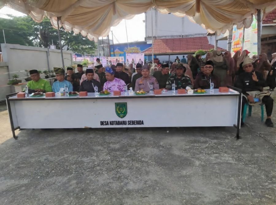 Danpos Ramil Keritang Peltu Doni Akmal Hadiri Milad Ke-86 Desa Kota Baru Seberida