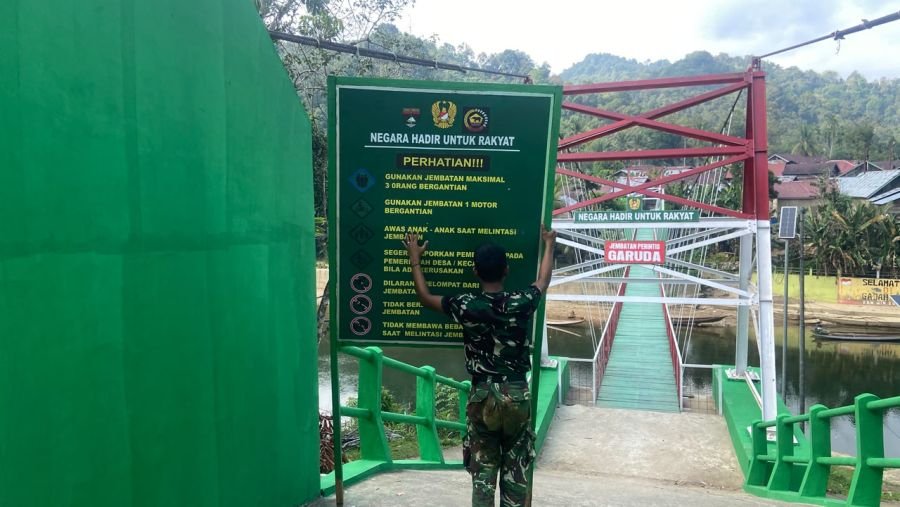 Identitas Infrastruktur Rampung, Satgas Kodim 0313/KPR Pasang Plang Resmi Jembatan Gajah Bertalut