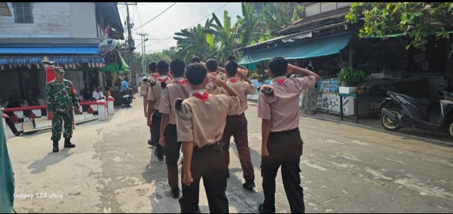 Kegiatan Personel Koramil 06/Serasan DPP Serka A. Harahap Melaksanakan Pengamanan Lomba Gerak Jalan