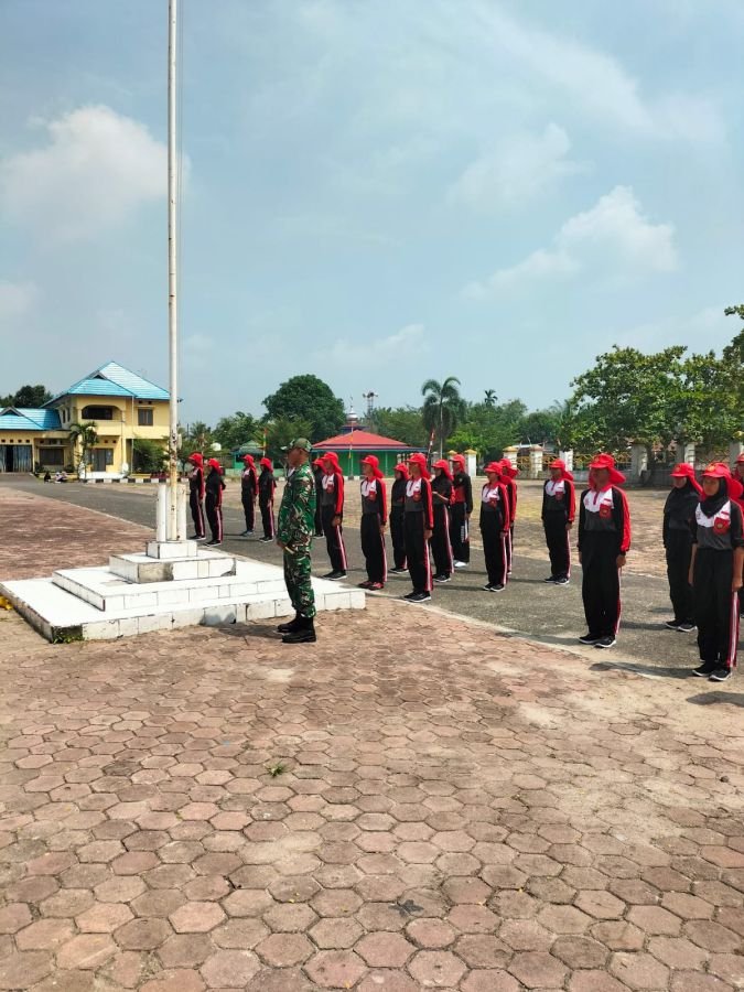 Melaksanakan Kegiatan latihan Pasukan Paskibra kecamatan Tanah Putih Tanjung Melawan.